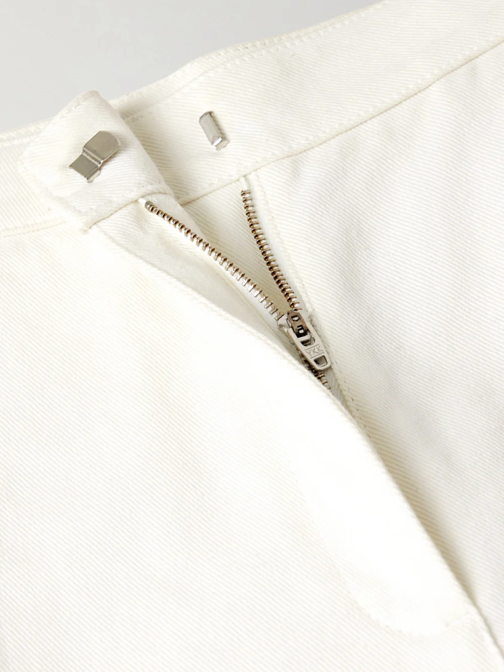 Close-up detail of the Fforme Strider High-rise Wide-leg Jeans