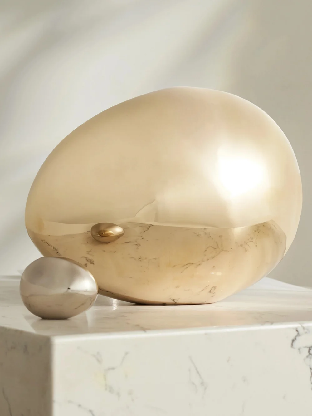 Fourth Street Egg Brass Ornament, styled view