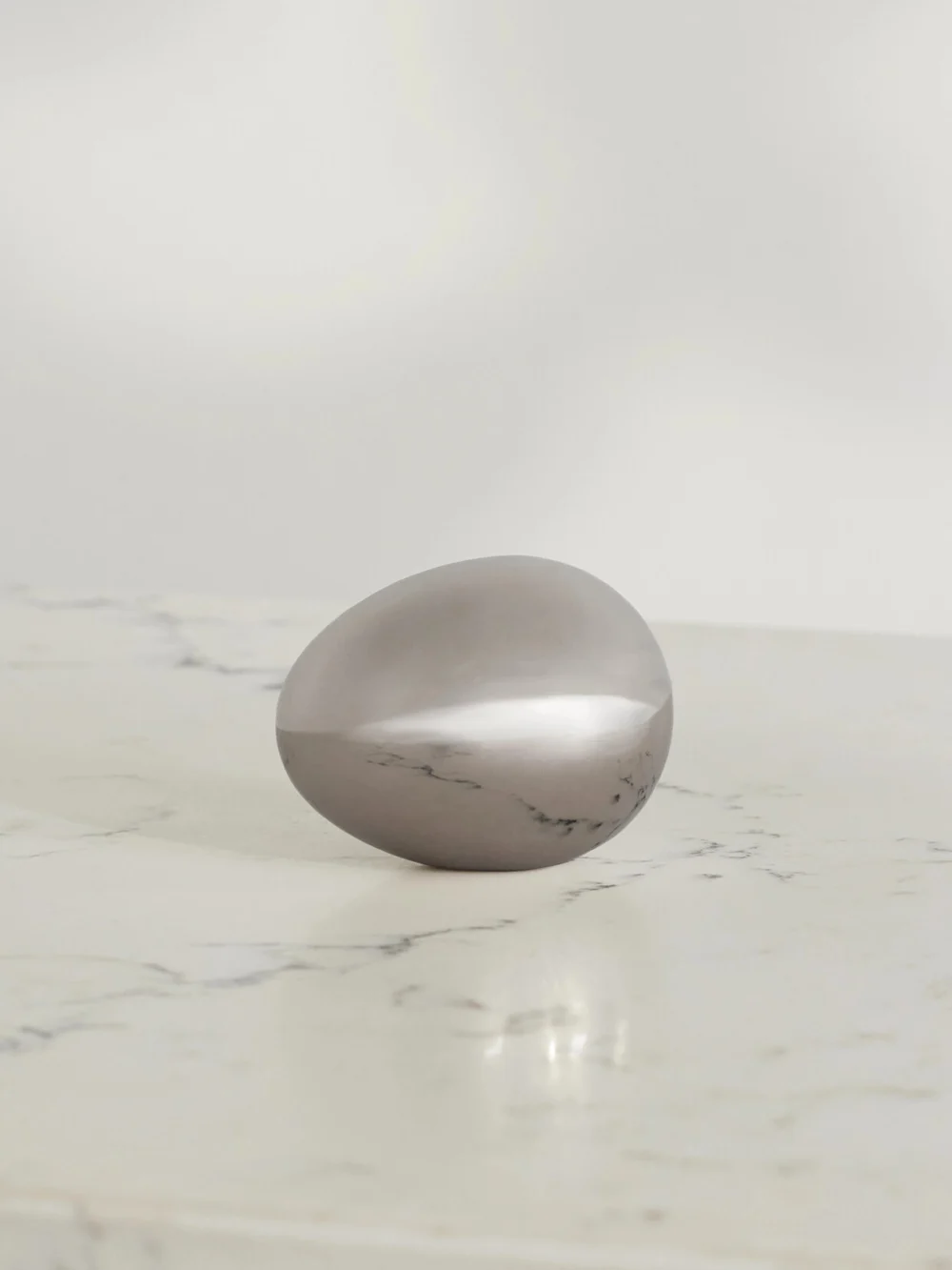 Fourth Street Egg Steel Paperweight in silver