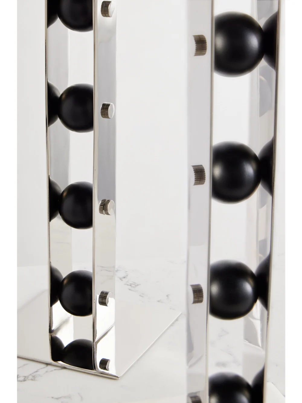 Close-up detail of the Fourth Street Set of Three Iron and Steel Candlesticks