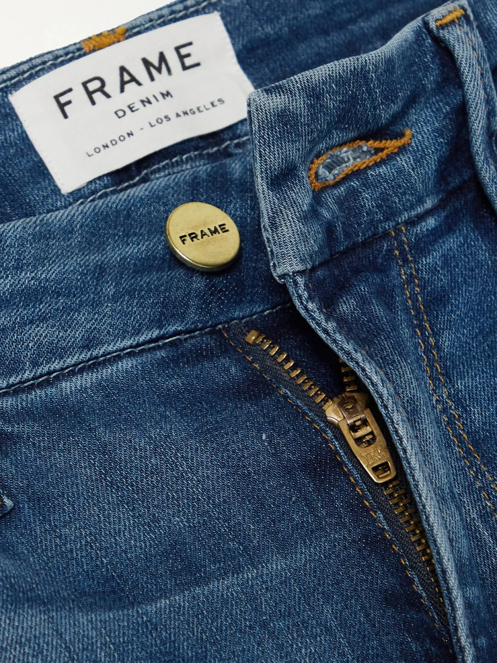 Close-up detail of the Frame Le Mini Boot Mid-rise Flared Jeans