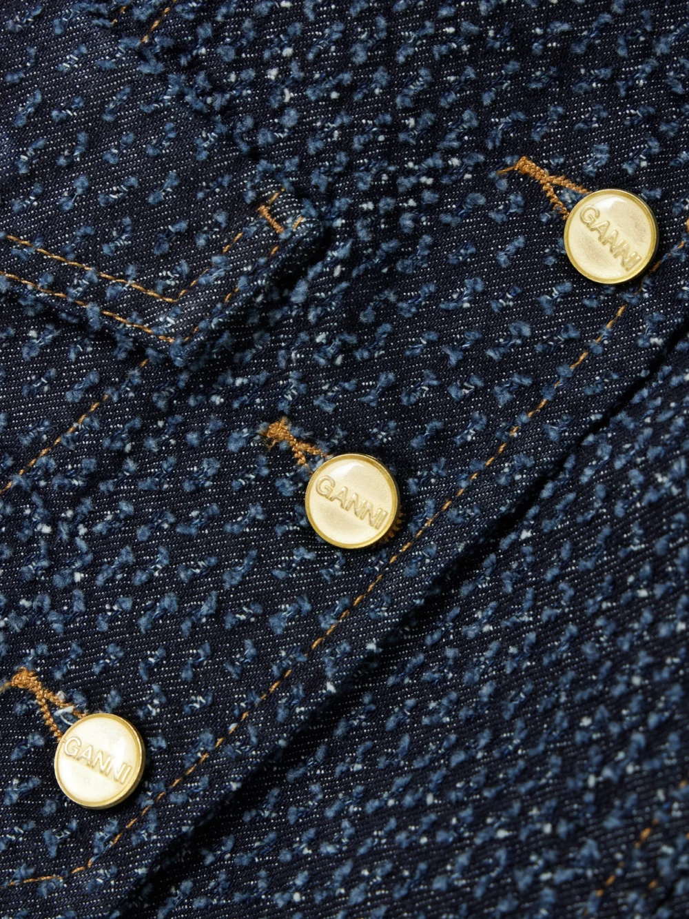 Close-up detail of the Ganni Fluffy Distressed Organic Denim Vest