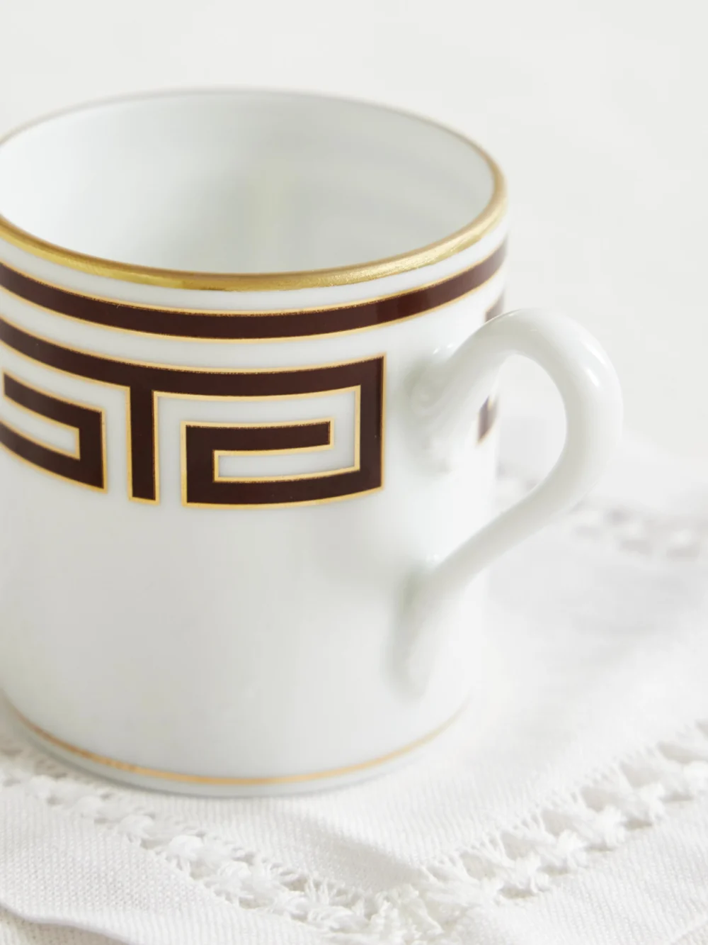 Close-up detail of the Ginori Labirinto Gold-plated Porcelain Coffee Cup