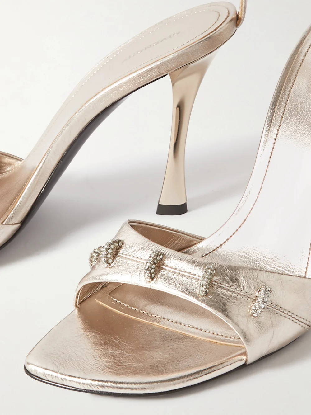 Close-up detail of the Givenchy Stitch Crystal-embellished Leather Sandals