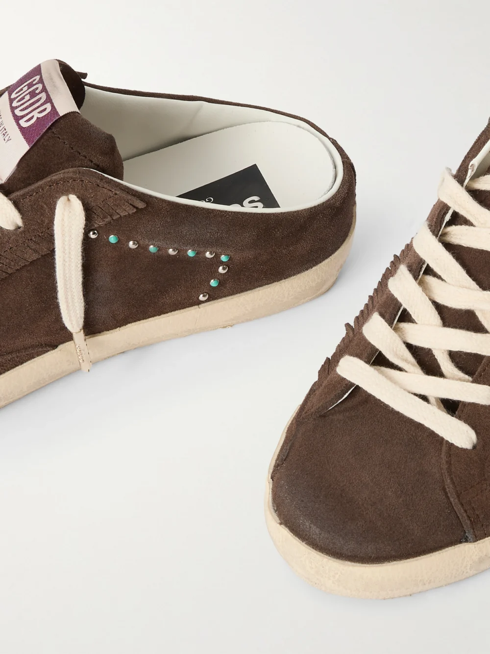 Close-up detail of the Golden Goose Super-star Sabot Distressed Leather-trimmed Studded Suede Slip-on Sneakers