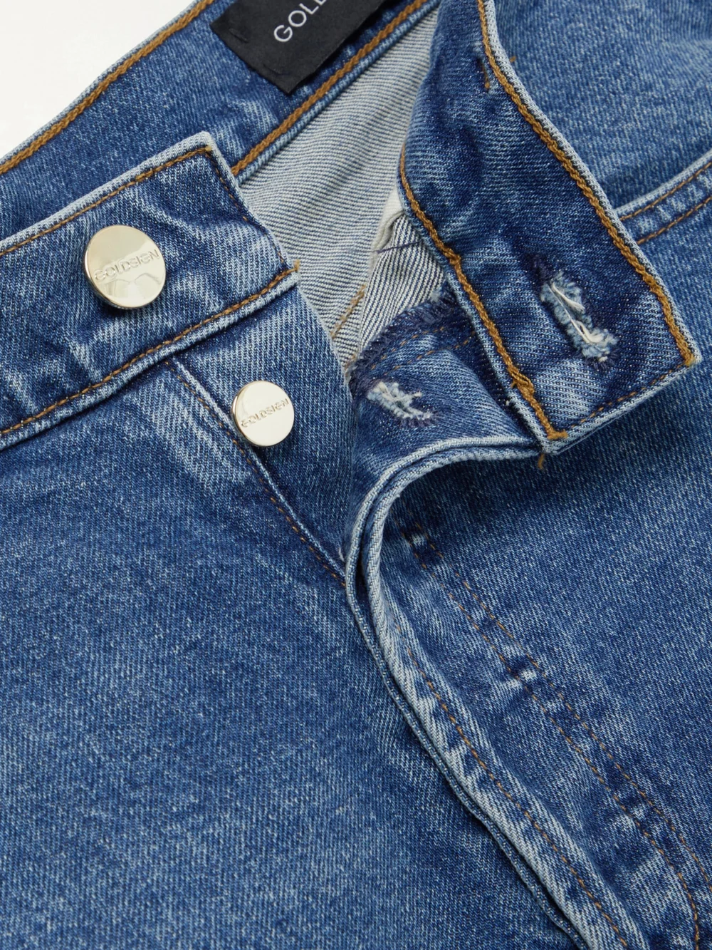 Close-up detail of the Goldsign High-rise Straight-leg Jeans
