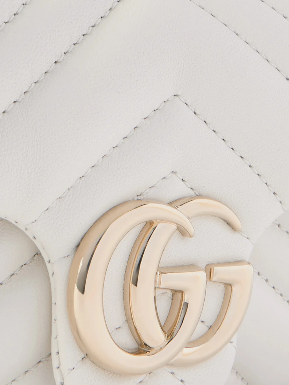 Close-up detail of the Gucci Gg Marmont Mini Matelassé Leather Shoulder Bag