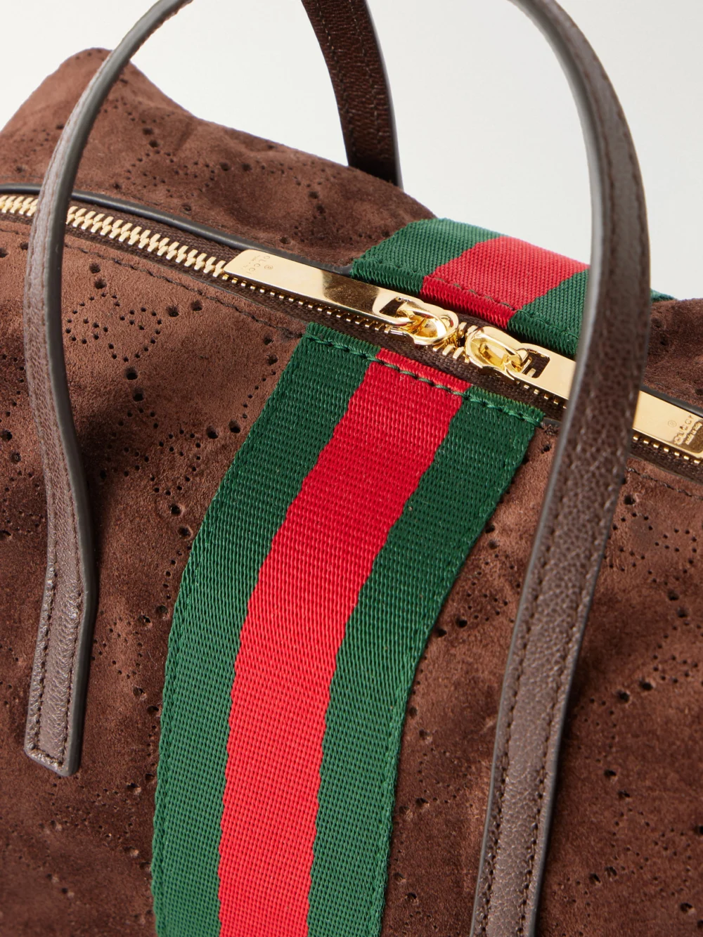 Close-up detail of the Gucci Gucci Essence Web and Leather-trimmed Perforated Suede Shoulder Bag