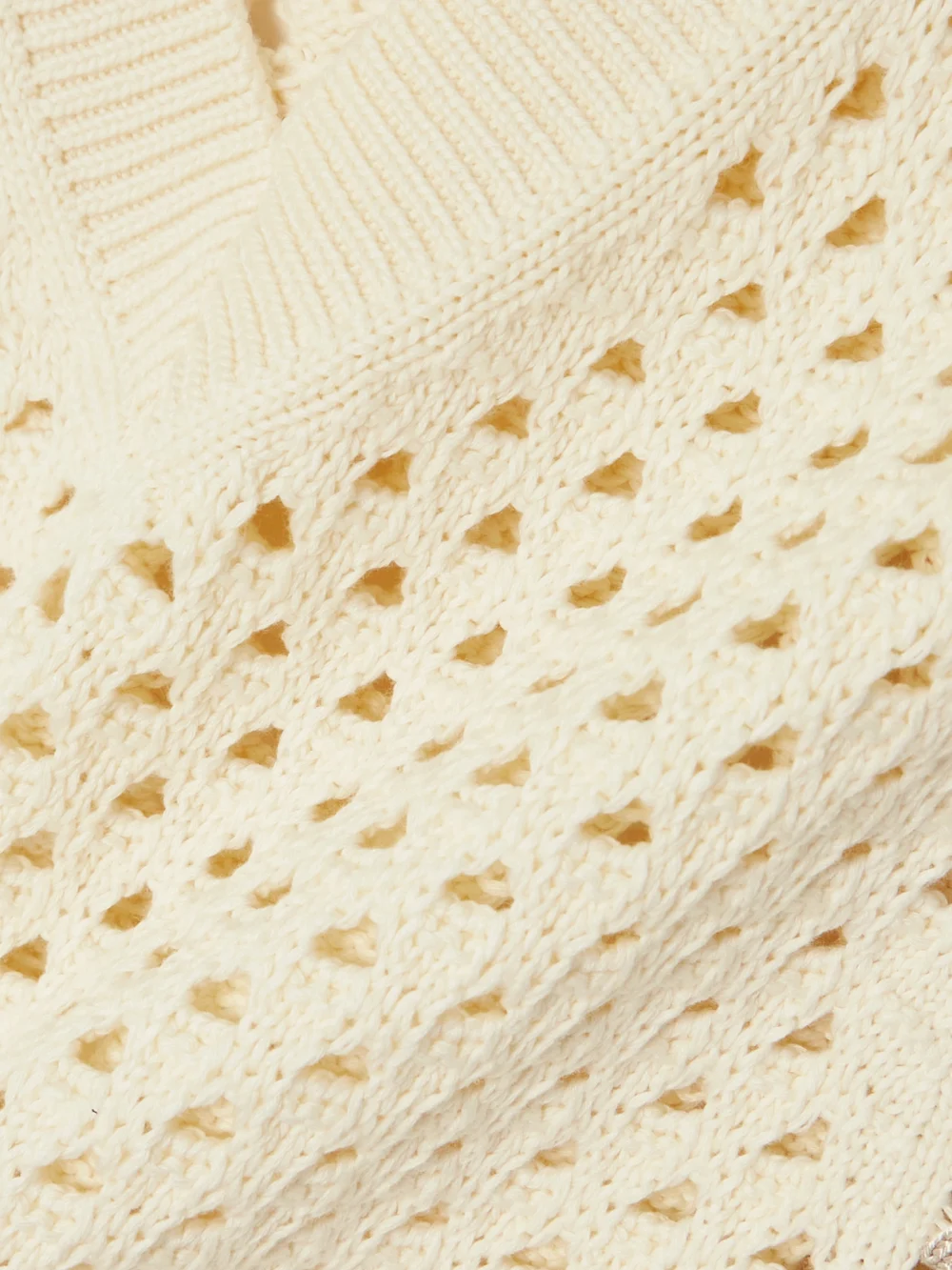 Close-up detail of the Guest In Residence Cropped Open-knit Cotton Vest