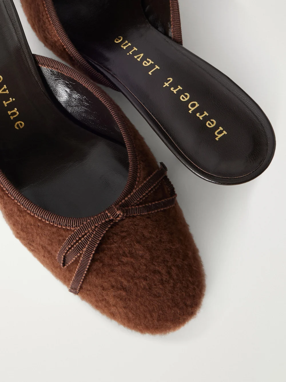 Close-up detail of the Herbert Levine 24/7 50 Bow-detail Shearling Mules