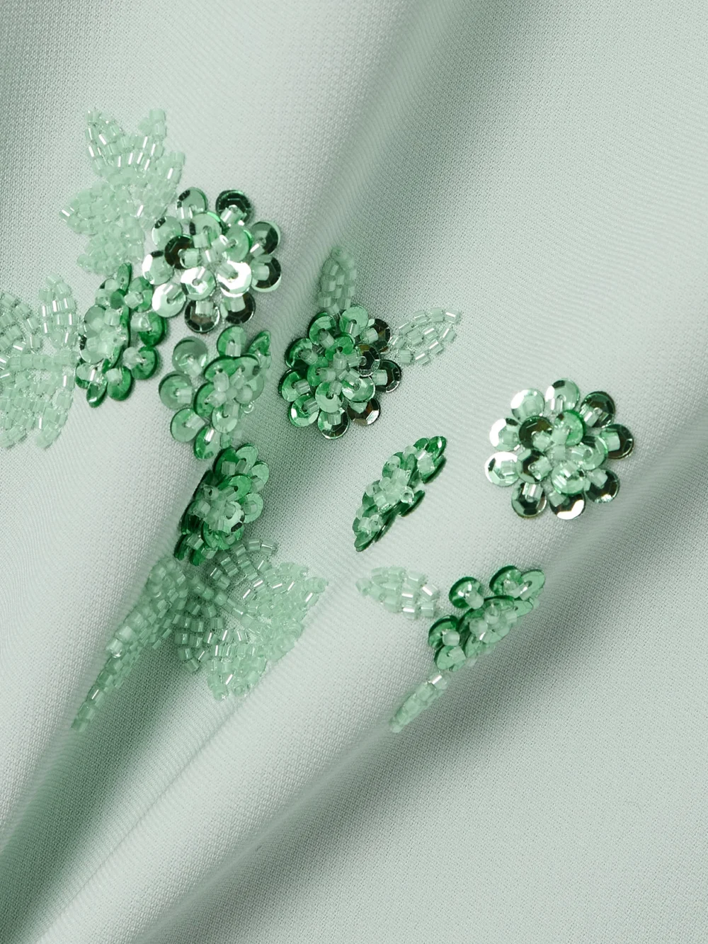 Close-up detail of the Huishan Zhang Elias Feather-trimmed Embellished Recycled Crepe-jersey Gown