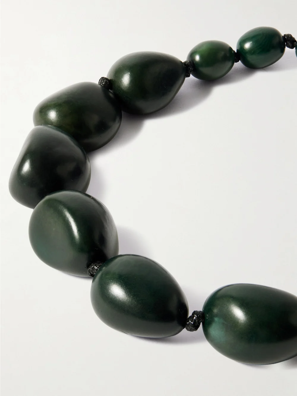 Close-up detail of the Hunting Season The Statement Tagua and Leather Necklace