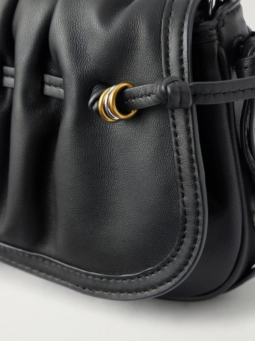 Close-up detail of the Isabel Marant Bolton Embellished Gathered Leather Shoulder Bag