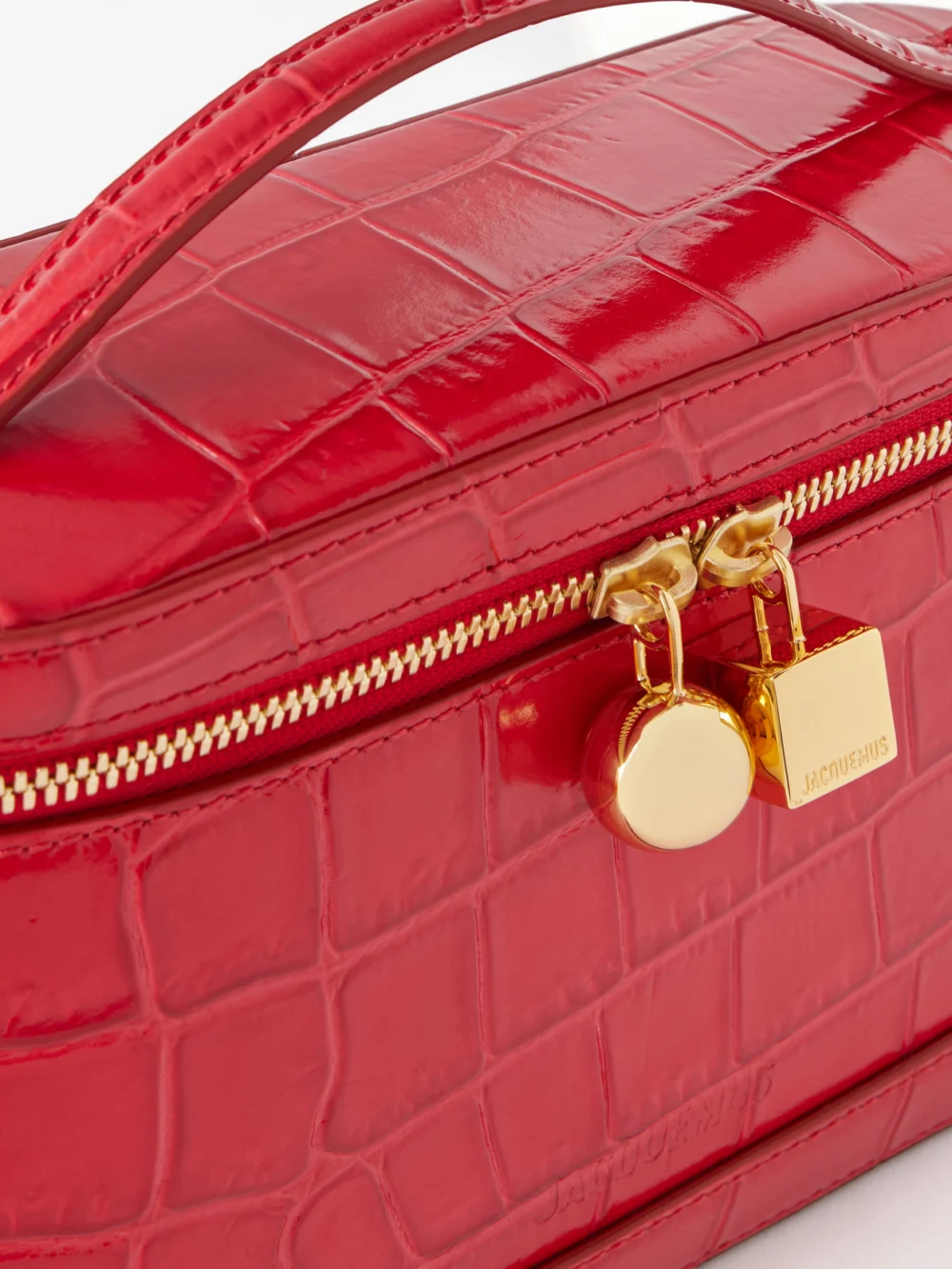 Close-up detail of the Jacquemus Le Petit Vanity Croc-effect Leather Top-handle Bag