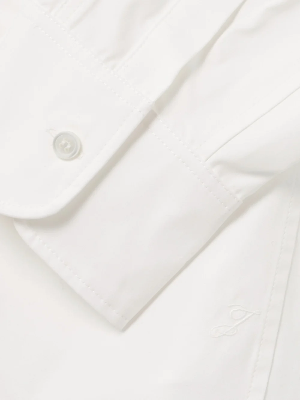 Close-up detail of the Jacquemus Ovalo Embroidered Cotton-poplin Shirt
