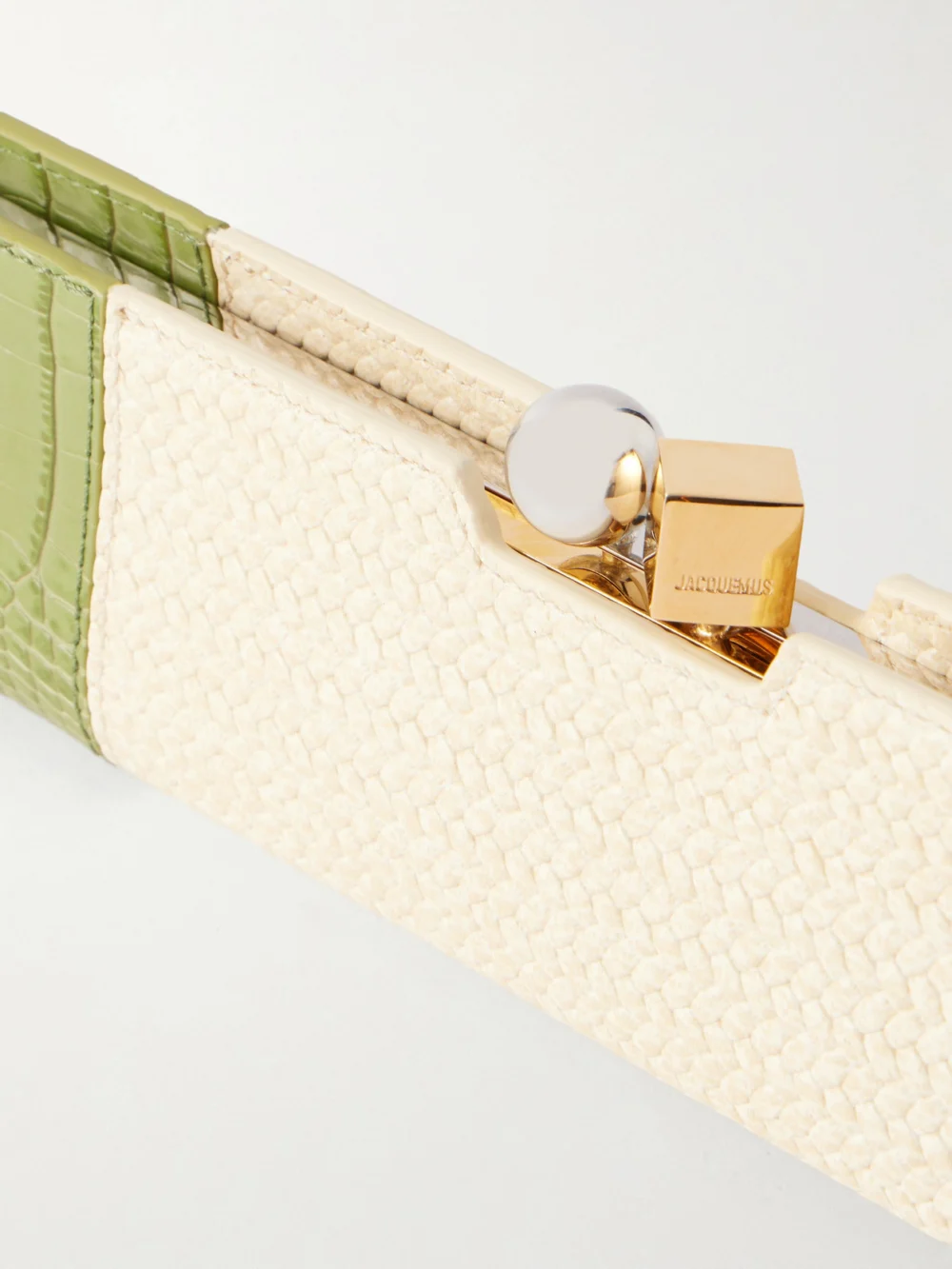 Close-up detail of the Jacquemus Poireau Fringed Textured-leather Clutch