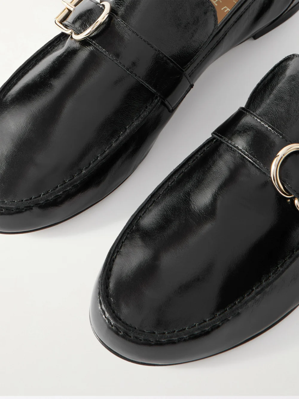 Close-up detail of the Jamie Haller Buckled Glossed-leather Loafers