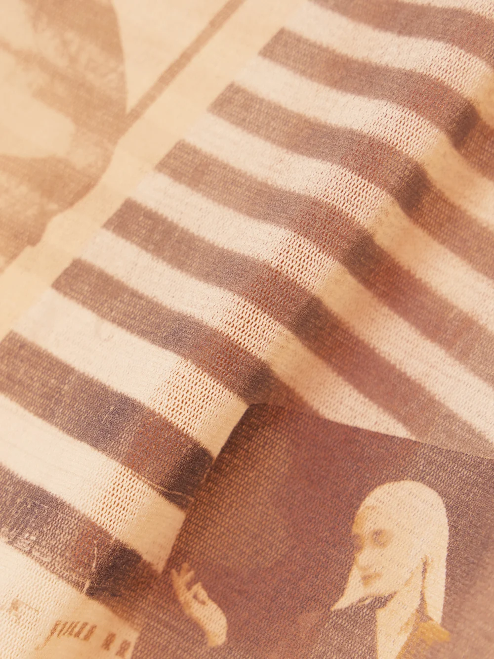 Close-up detail of the Jean Paul Gaultier Journal Printed Mesh Top