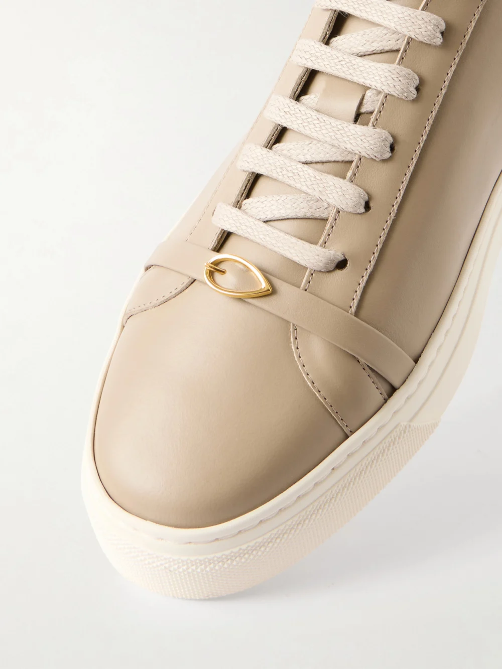 Close-up detail of the Jennifer Chamandi Embellished Leather Sneakers