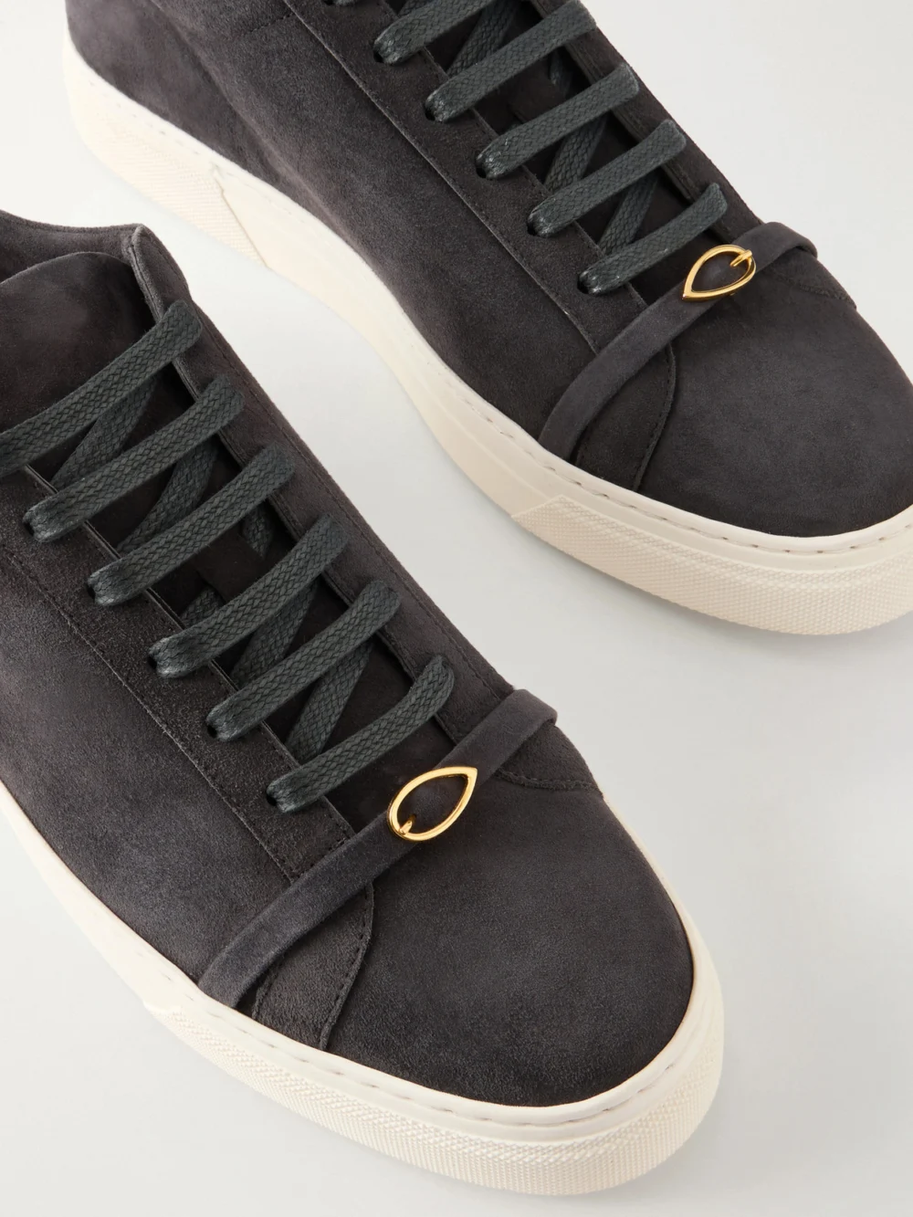 Close-up detail of the Jennifer Chamandi Embellished Suede Sneakers