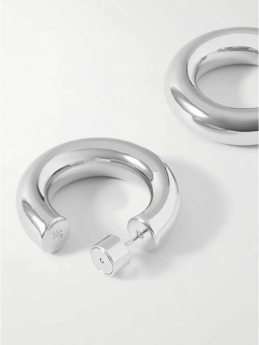 Close-up detail of the Jennifer Fisher Jamma Huggies Silver-plated Hoop Earrings