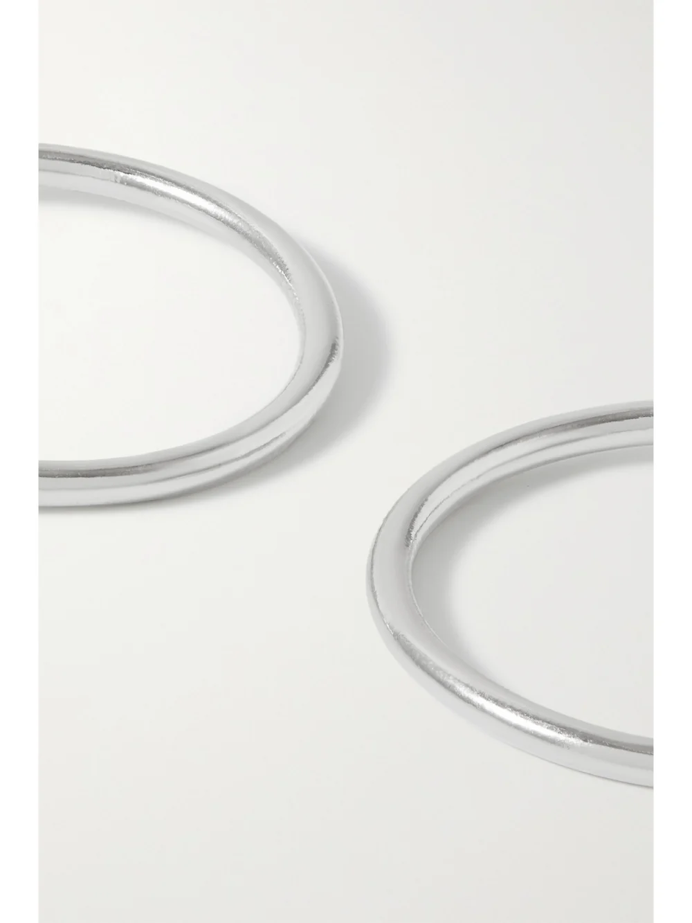 Close-up detail of the Jennifer Fisher Mini Thread Silver-plated Hoop Earrings