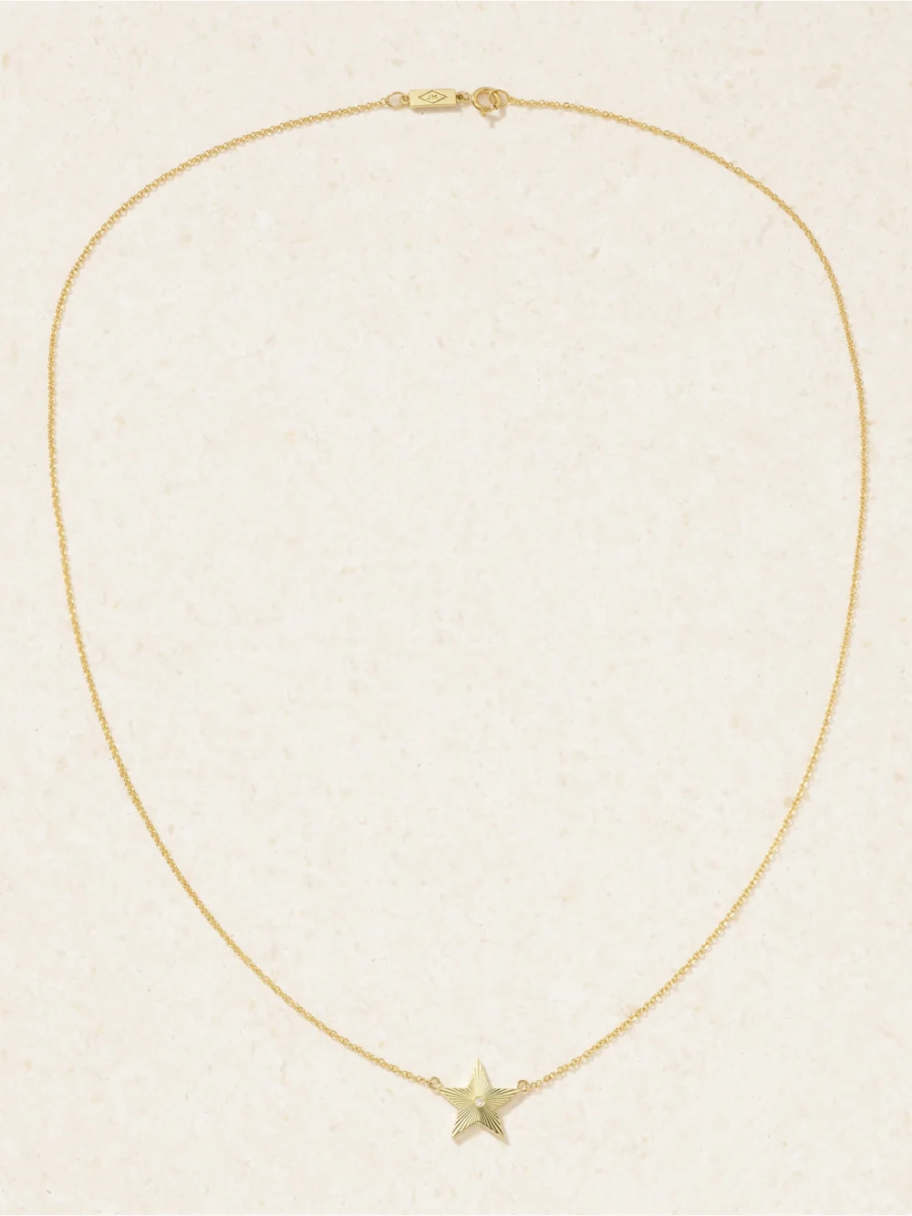 Close-up detail of the Jennifer Meyer Mini 70s Star 18-karat Gold Diamond Necklace