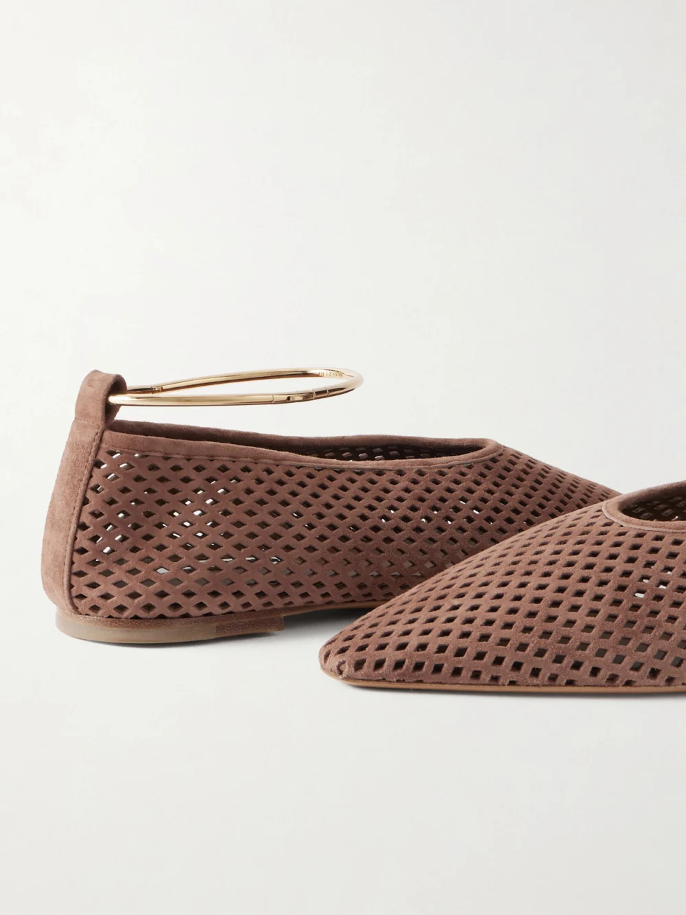 Close-up detail of the Jil Sander Ballerina Embellished Laser-cut Suede Pointed-toe Ballet Flats