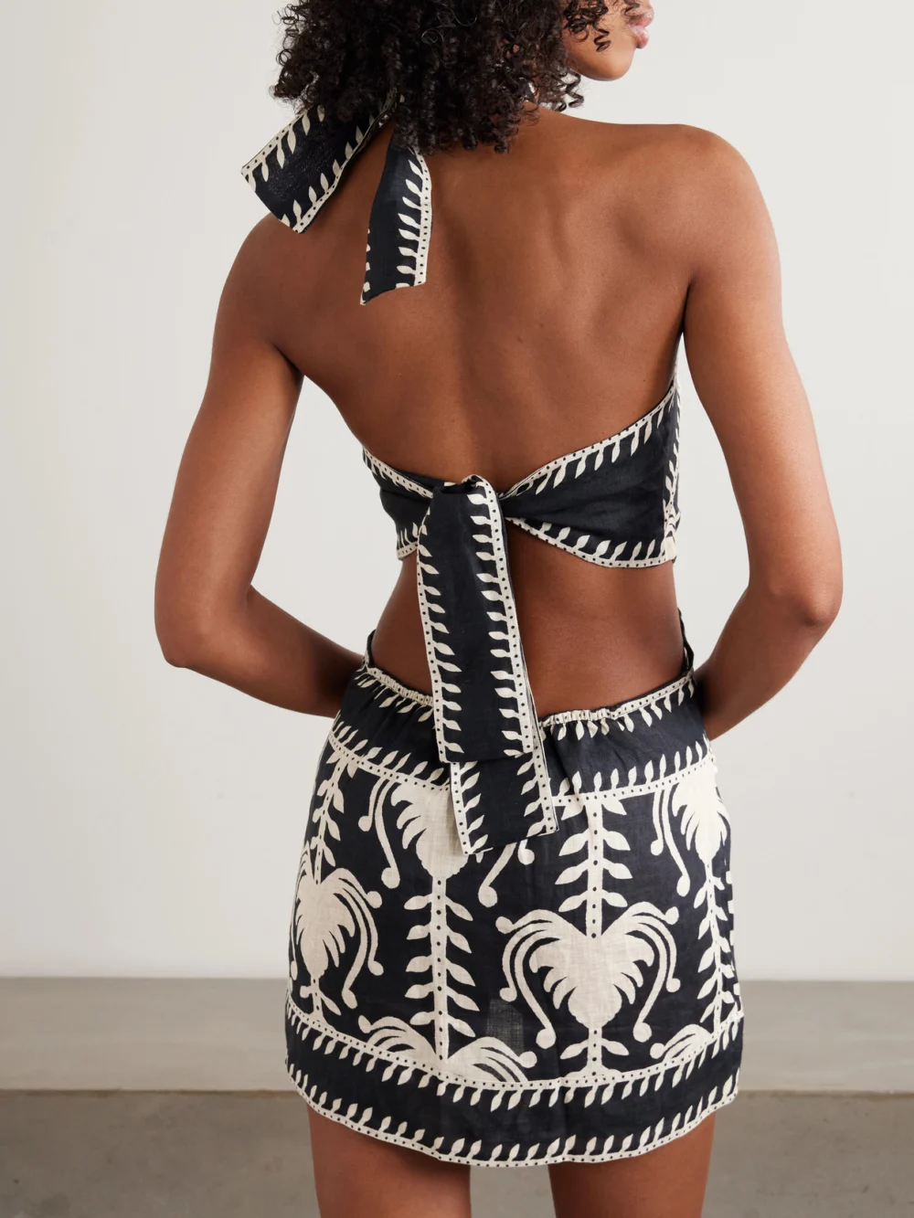 Back view of the Johanna Ortiz Tide Strength Open-back Printed Woven Halterneck Mini Dress