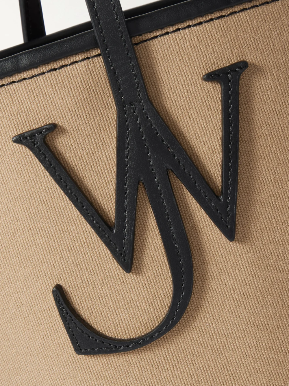 Close-up detail of the JW Anderson Anchor Small Leather-trimmed Canvas Tote