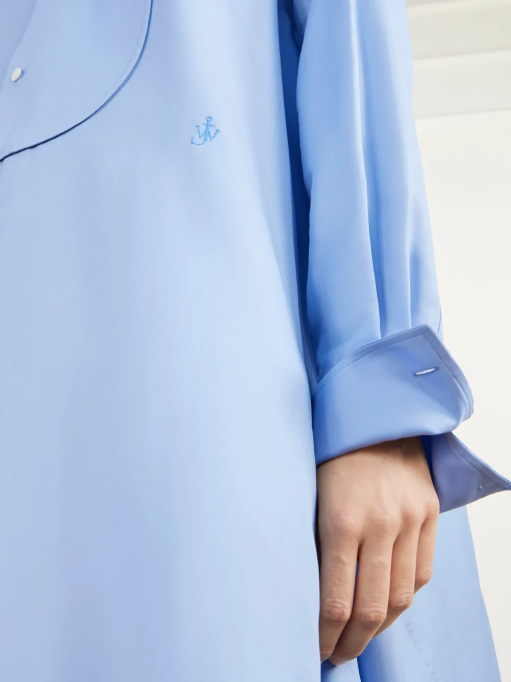 Close-up detail of the JW Anderson Tie-detailed Logo-embroidered Cotton and Silk-blend Poplin Mini Dress