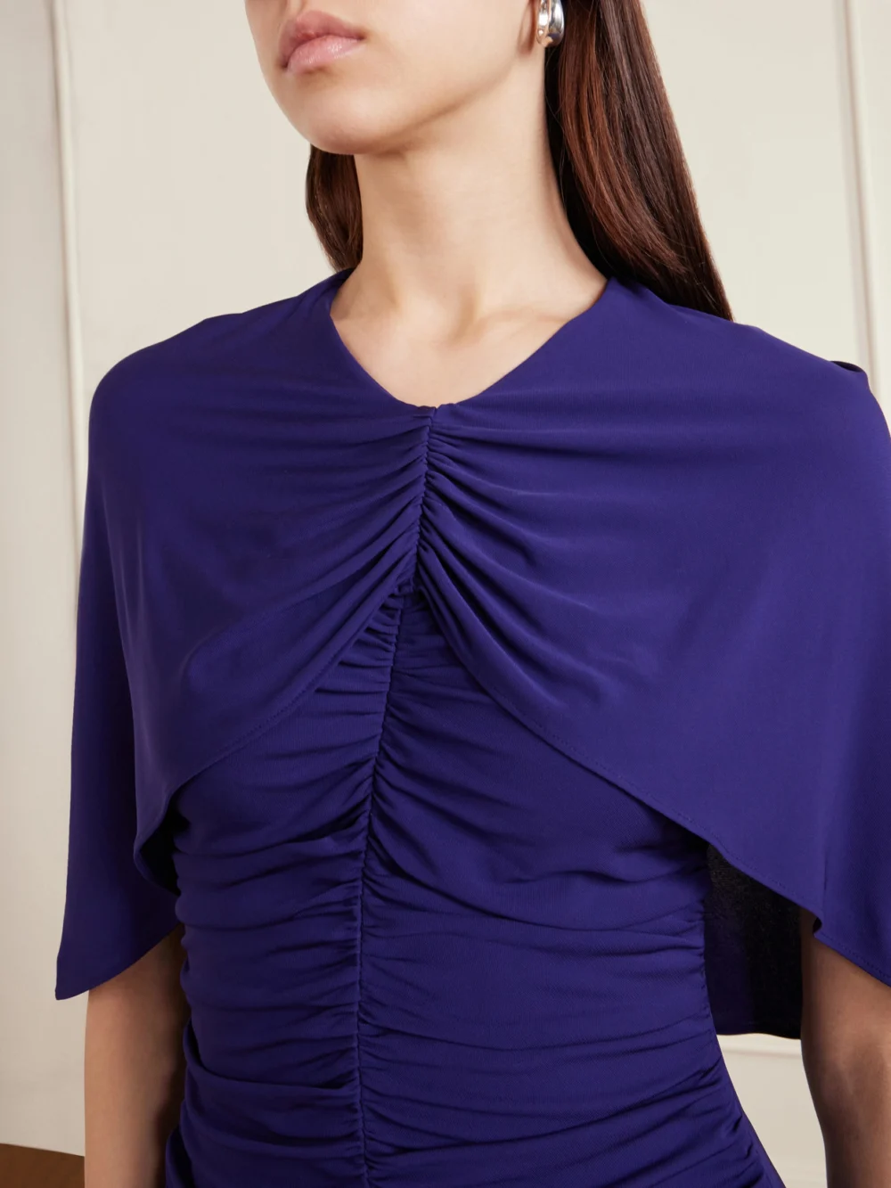 Close-up detail of the Kallmeyer Matilda Ruched Cape-effect Jersey Gown