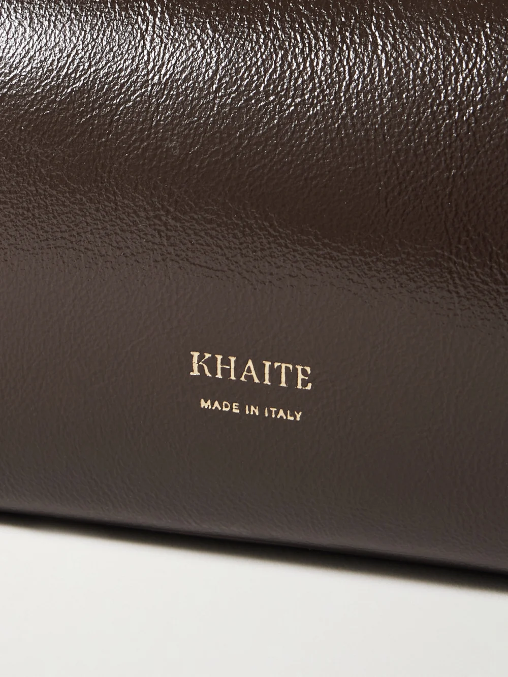 Close-up detail of the Khaite Kye Glossed-leather Shoulder Bag