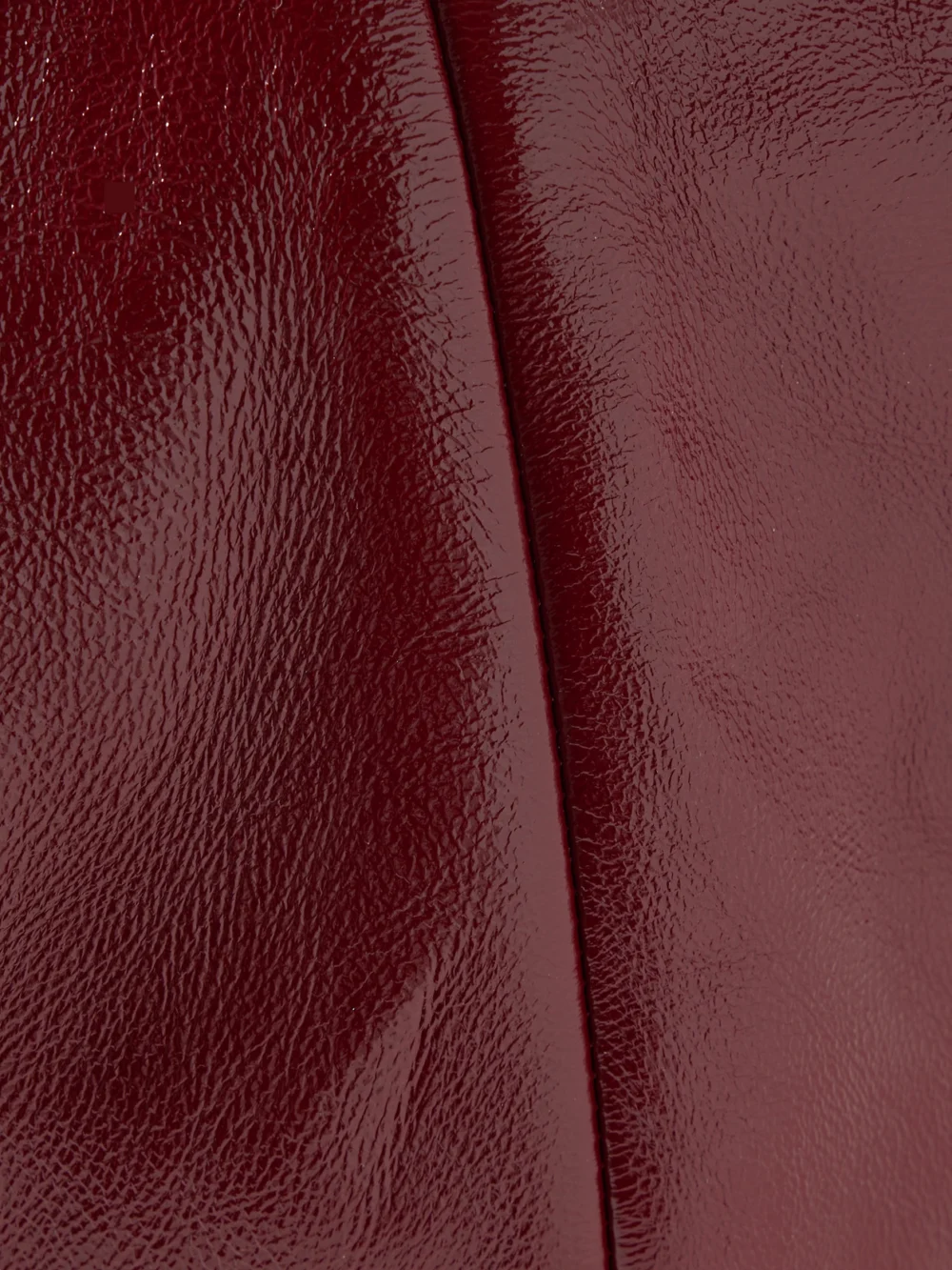 Close-up detail of the Khaite Olivia Medium Crinkled Patent-leather Top-handle Bag