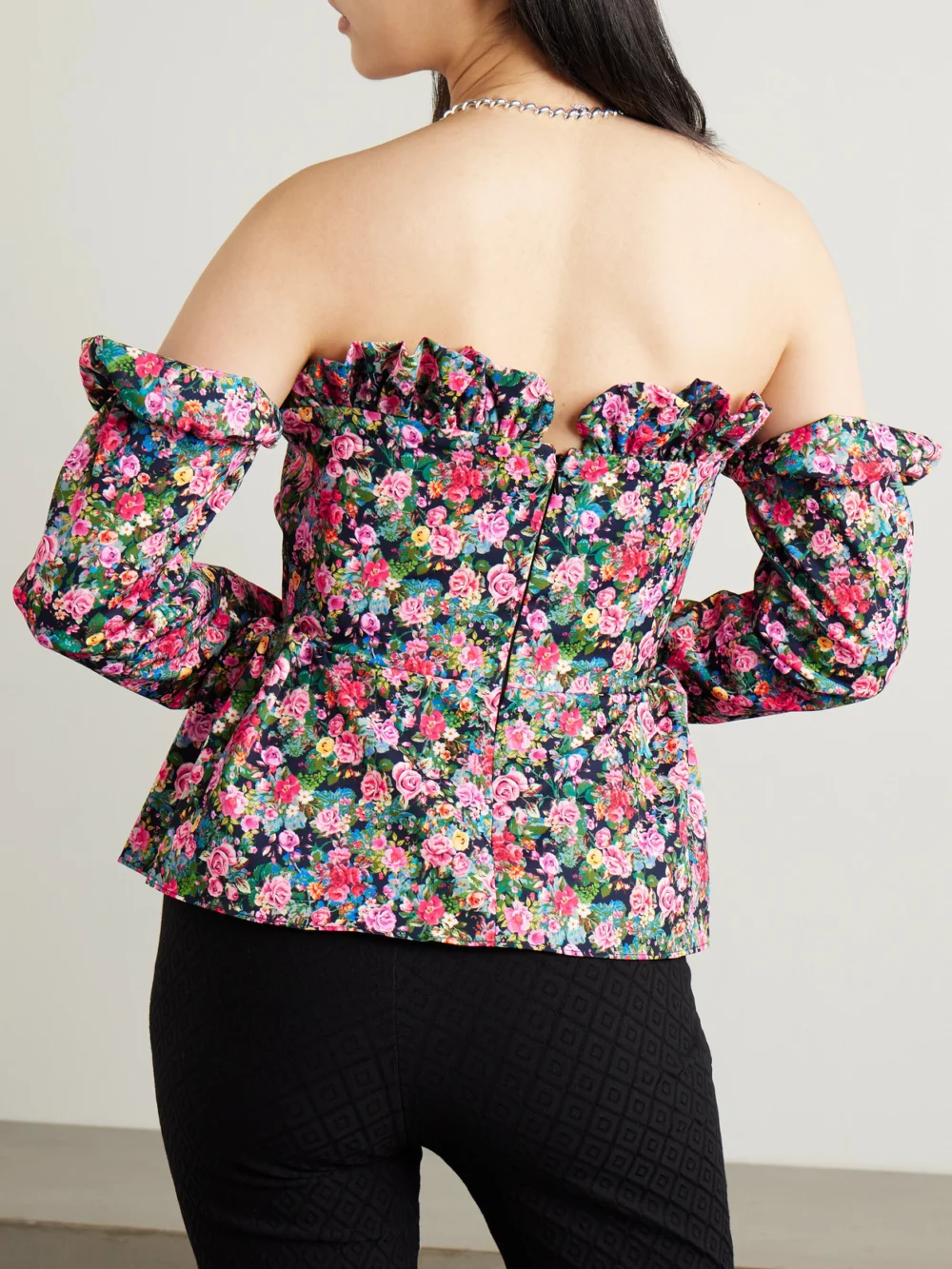 Back view of the Kika Vargas Jacqueline Off-the-shoulder Floral-print Woven Peplum Top