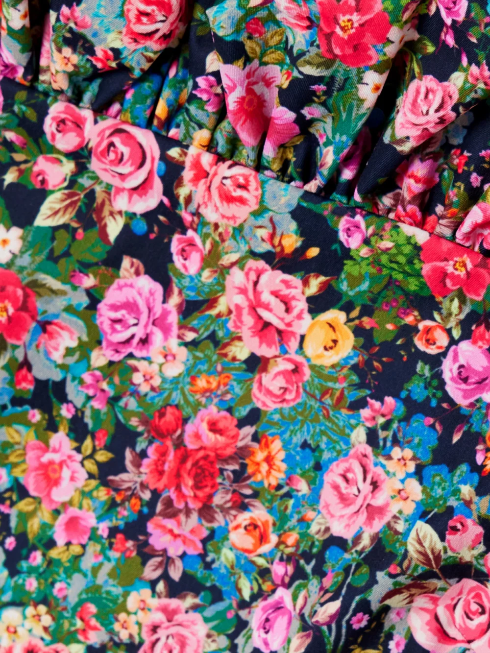 Close-up detail of the Kika Vargas Jacqueline Off-the-shoulder Floral-print Woven Peplum Top