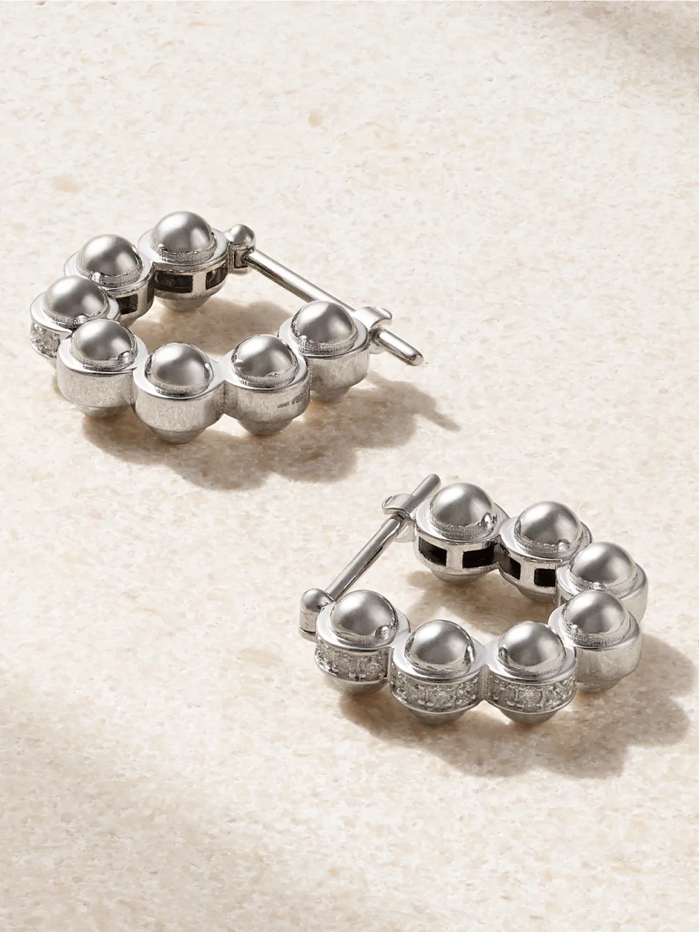 Close-up detail of the L'Atelier Nawbar The Atom 18-karat White Gold Diamond Hoop Earrings