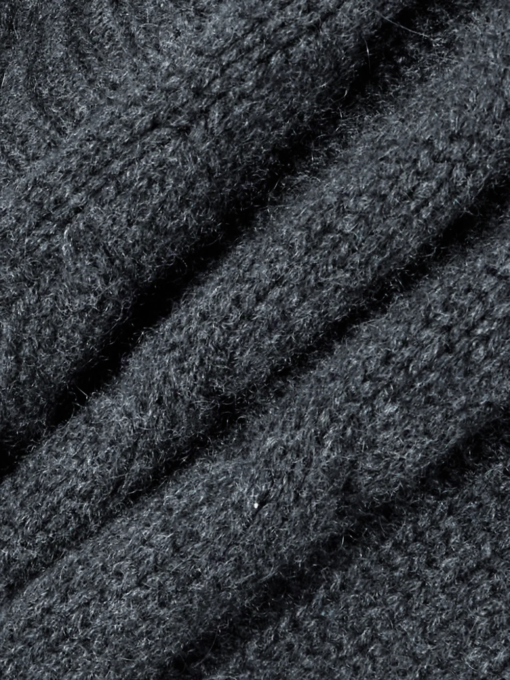 Close-up detail of the Le Kasha Baulieu Cable-knit Organic Cashmere Cardigan