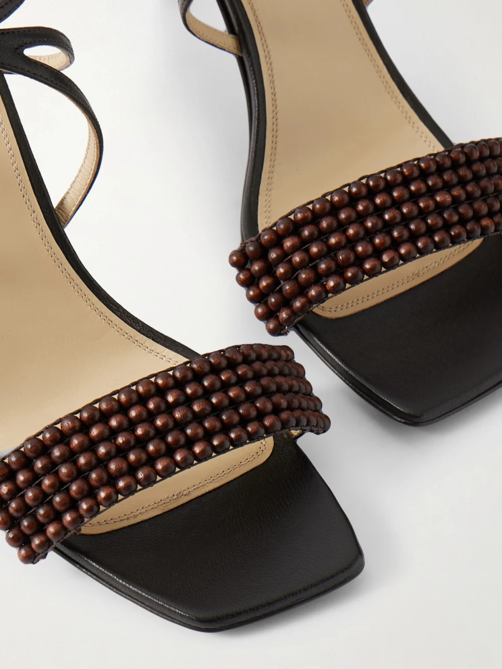 Close-up detail of the Lemaire Beaded Leather Sandals