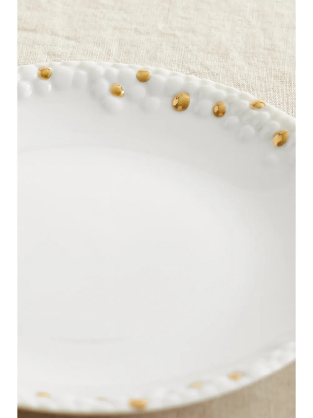 Close-up detail of the L'Objet + Haas Brothers Mojave 17cm Gold-plated Porcelain Plate