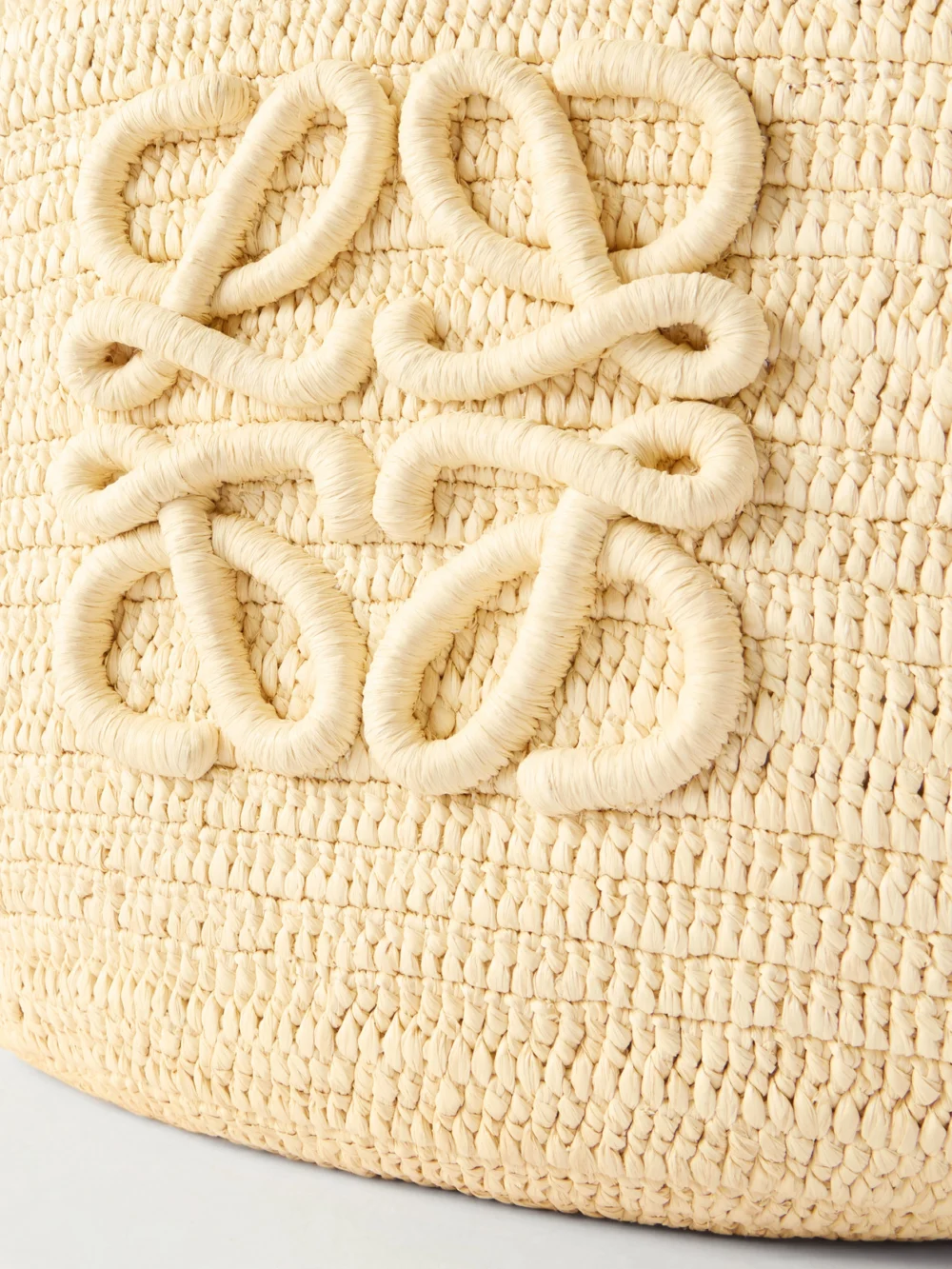 Close-up detail of the Loewe + Paula's Ibiza Eclipse Basket Medium Leather-trimmed Raffia Tote