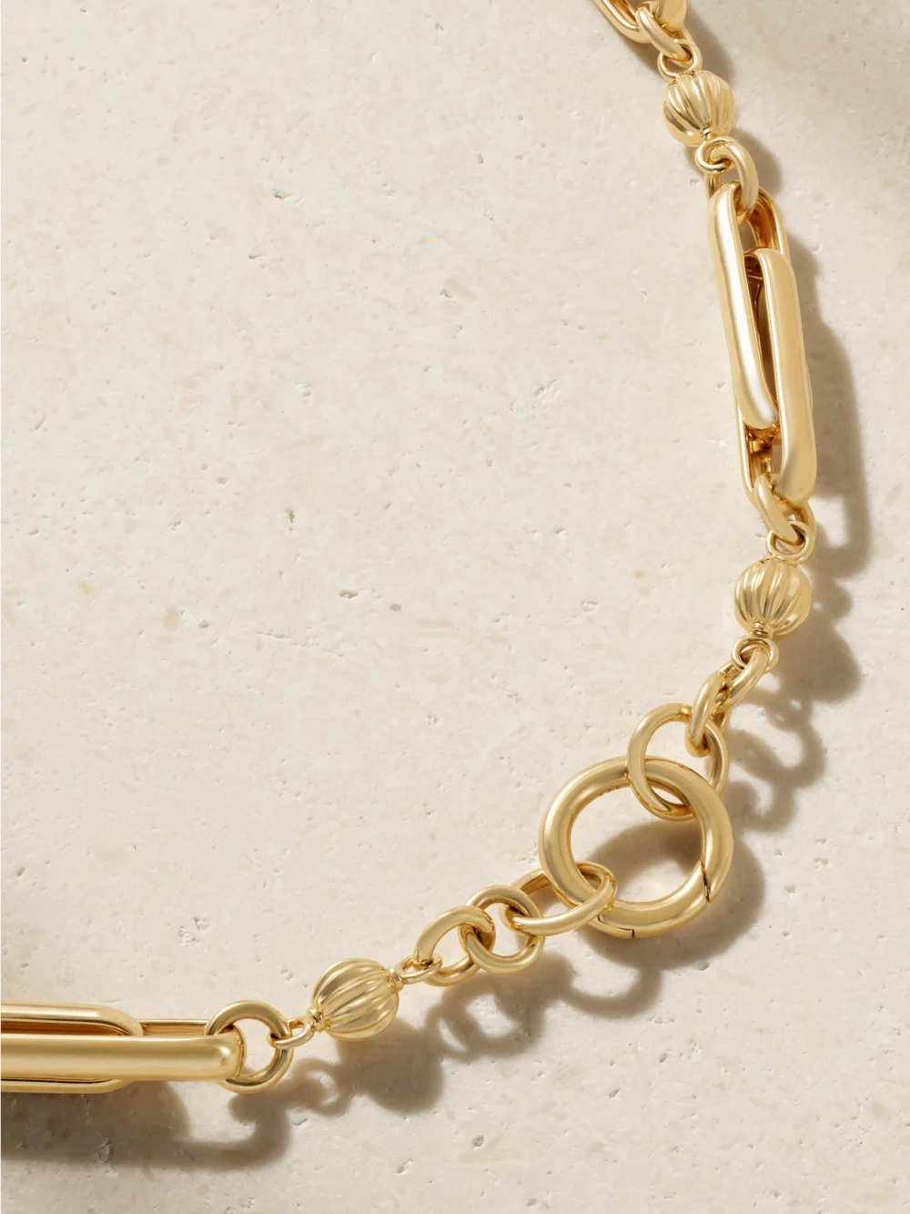 Close-up detail of the Lucy Delius Stirrup 14-karat Gold Necklace
