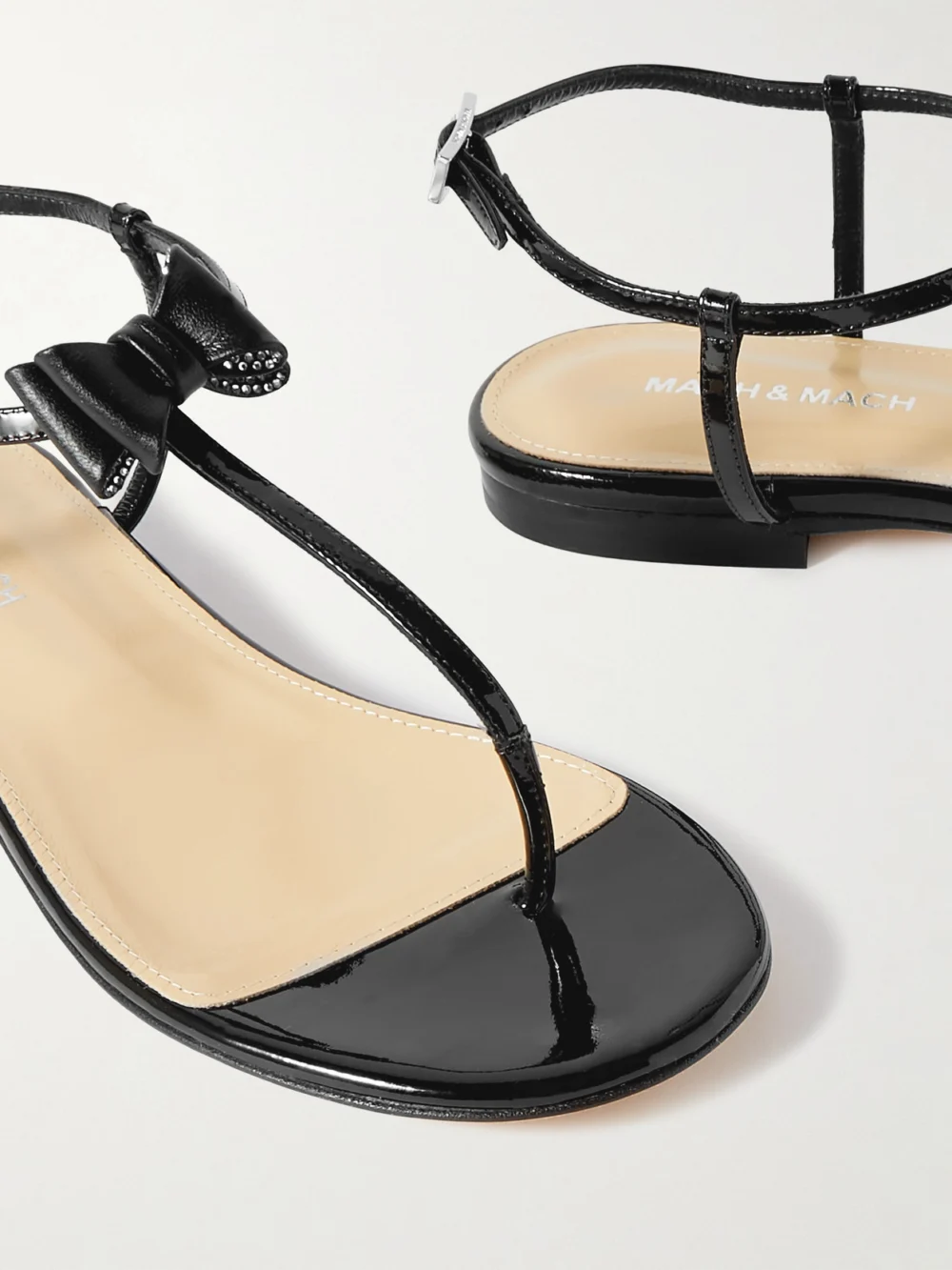 Close-up detail of the Mach & Mach Petite Cadeau Crystal and Bow-embellished Patent-leather Sandals
