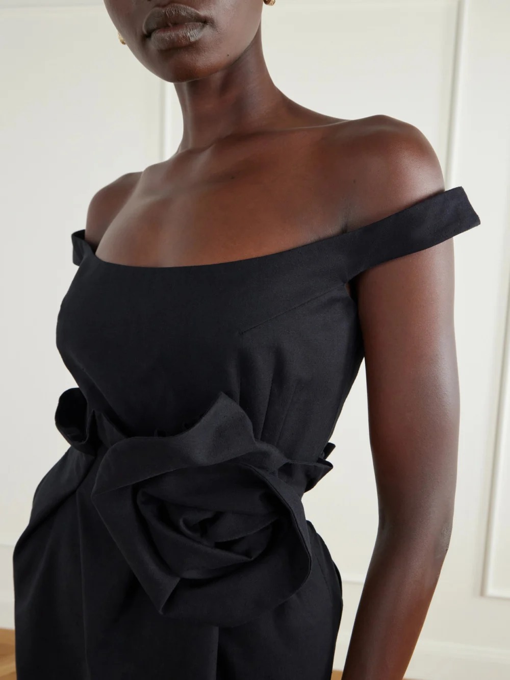 Close-up detail of the Magda Butrym Floral-appliquéd Off-the-shoulder Cotton Midi Dress