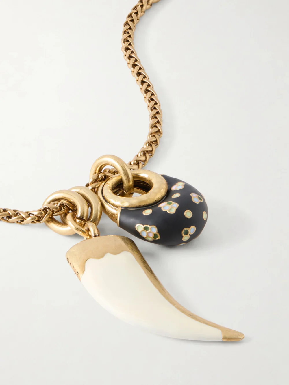 Close-up detail of the Maison Mayle Niki Horn of Plenty Gold-plated and Enamel Necklace