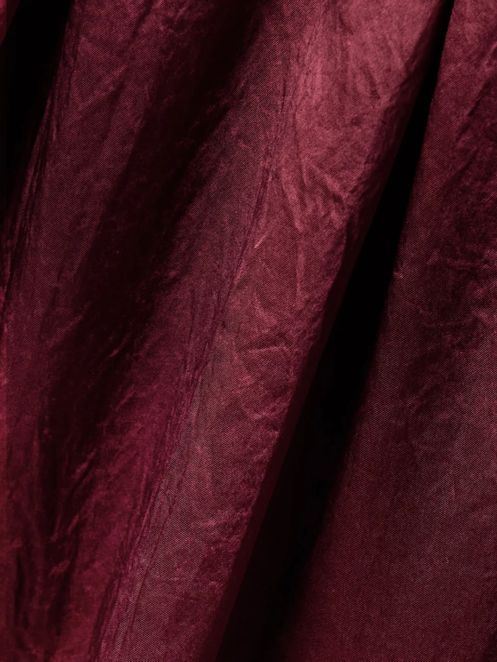 Close-up detail of the Maria McManus Belted Crinkled-satin Midi Dress