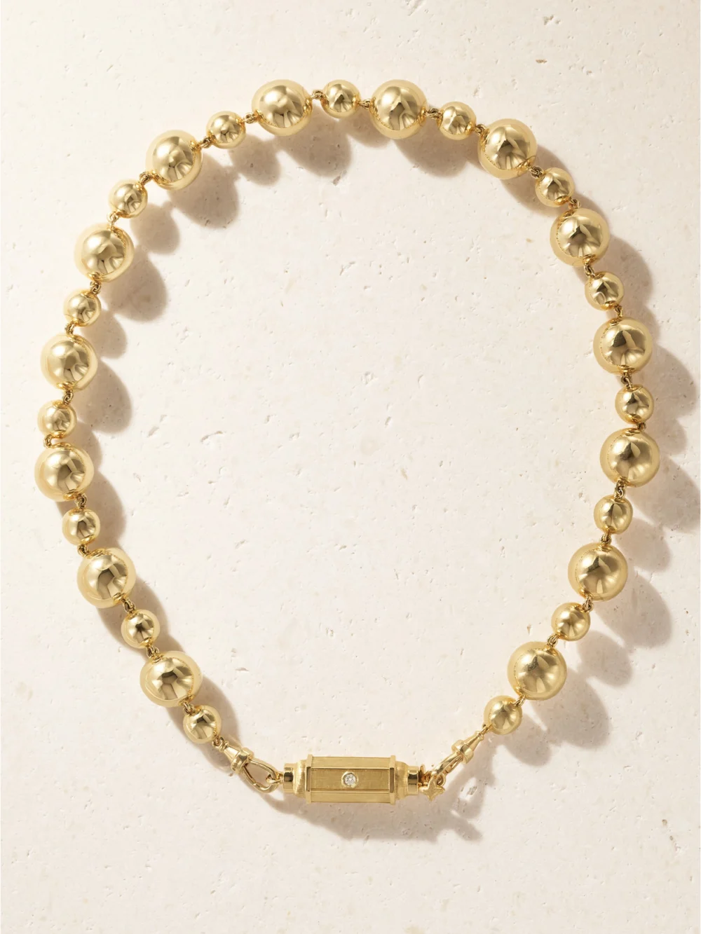 Close-up detail of the Marie Lichtenberg Baby Locket Grain D'or 14-karat Gold Diamond Necklace