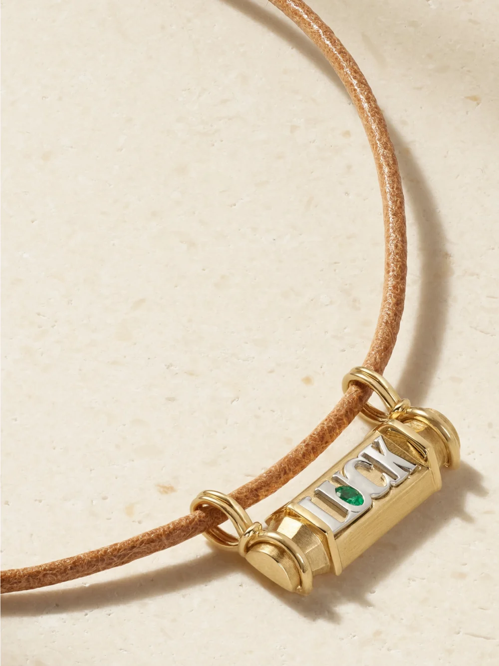 Close-up detail of the Marie Lichtenberg Luck 18-karat Yellow and White Gold, Emerald and Leather Necklace