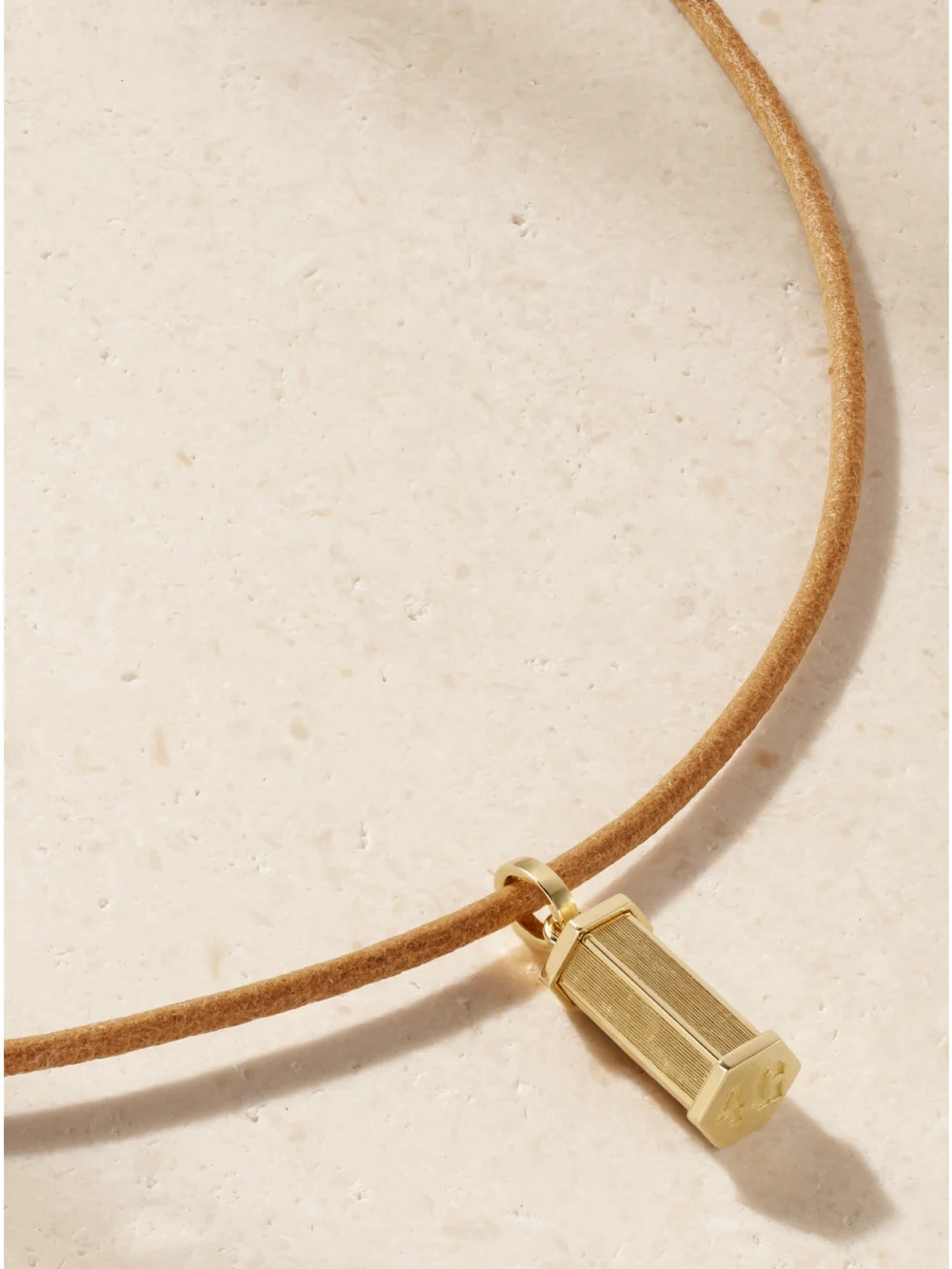 Close-up detail of the Marie Lichtenberg Micro Weight 18-karat Gold and Leather Necklace