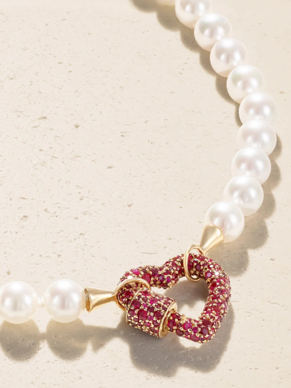 Close-up detail of the Marla Aaron Heartlock 14-karat Yellow Gold, Ruby and Pearl Necklace